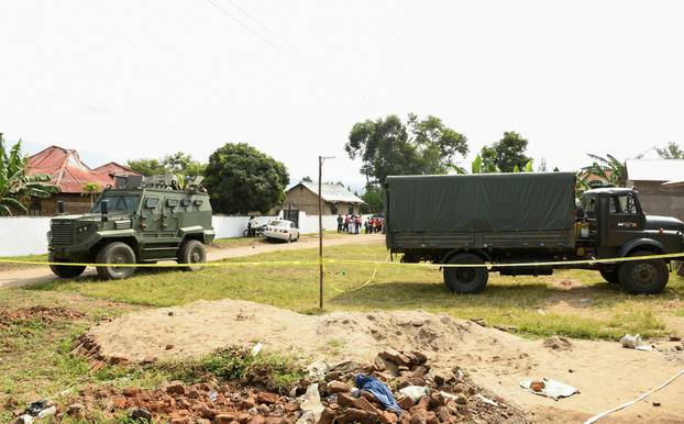 FILE PHOTO: Ugandan security forces cordon the scene outside the Mpondwe Lhubirira Secondary School