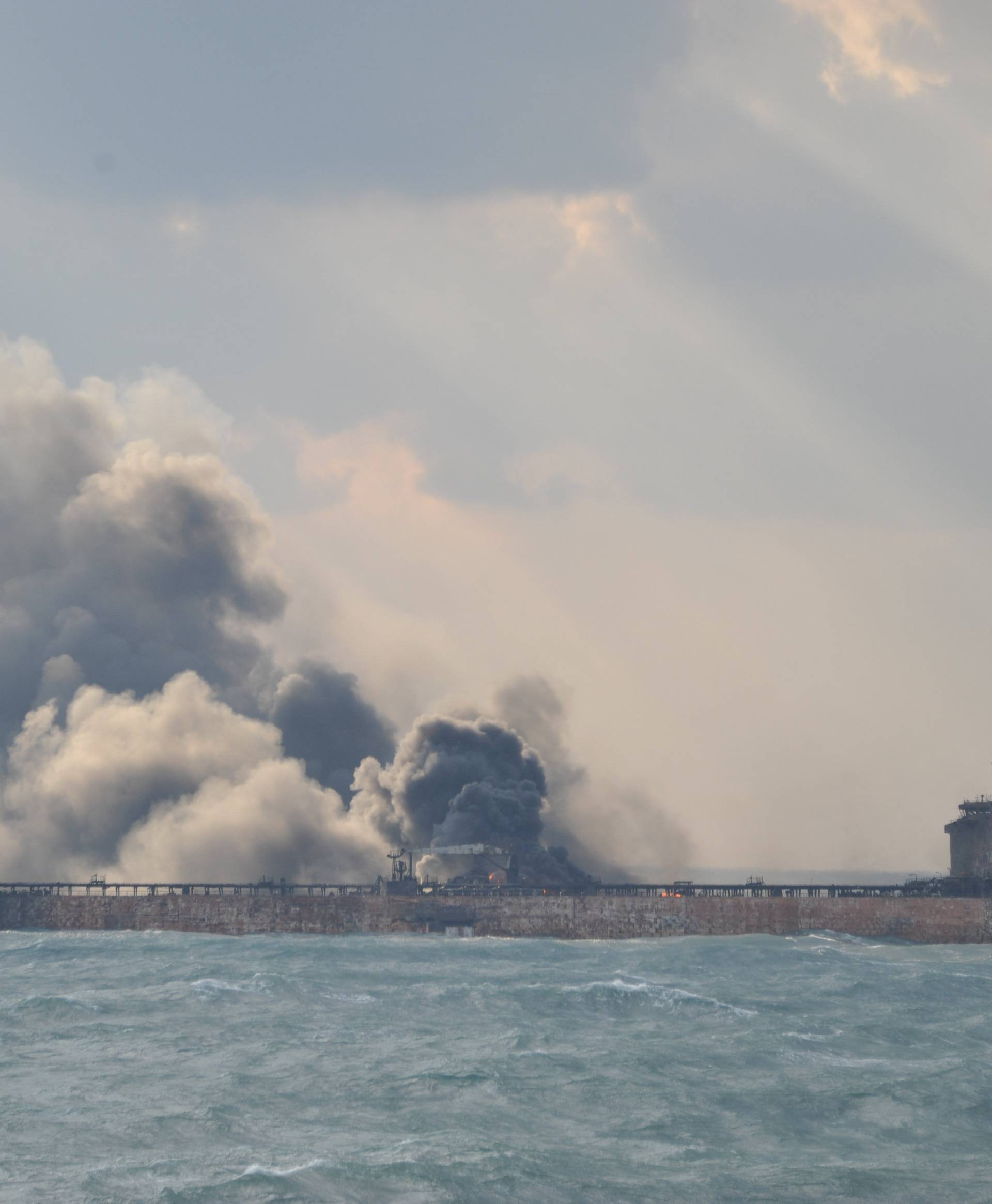 Smoke is seen from the Sanchi tanker which went ablaze after a collision with a Chinese freight ship in the East China Sea