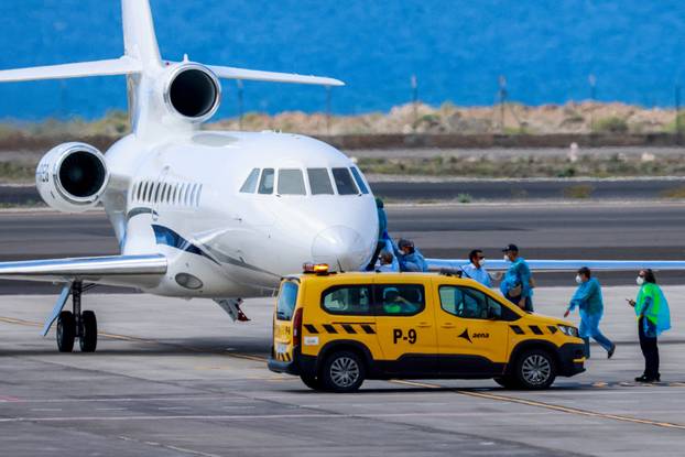 Passengers of the cruise ship MV Hondius, which was affected by a hantavirus outbreak, arrive at Tenerife Sud airport