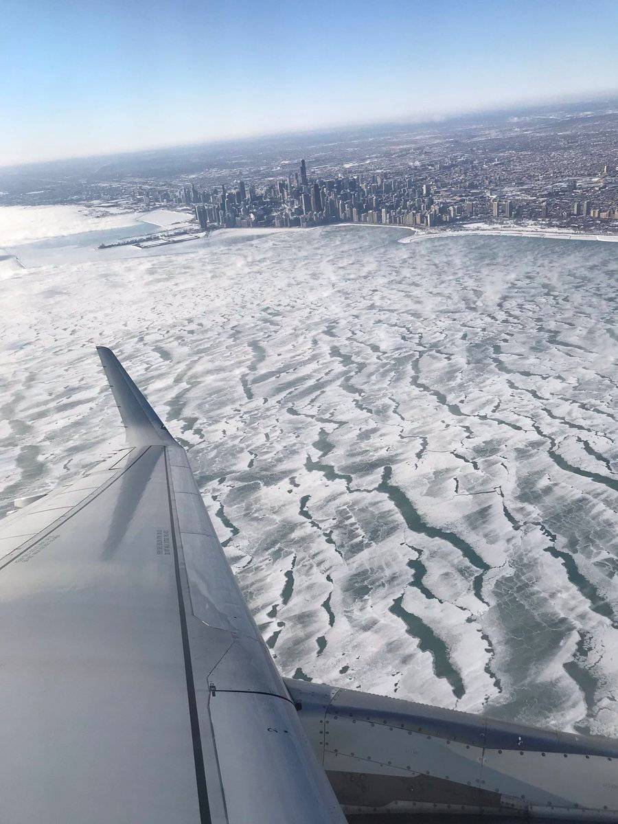 A view of frozen Lake Michigan during the polar vortex is seen from an airplane in Chicago, Illinois, U.S. in this photo obtained from social media