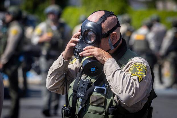 Standoff by protesters and law enforcement, following multiple detentions by ICE in Los Angeles County