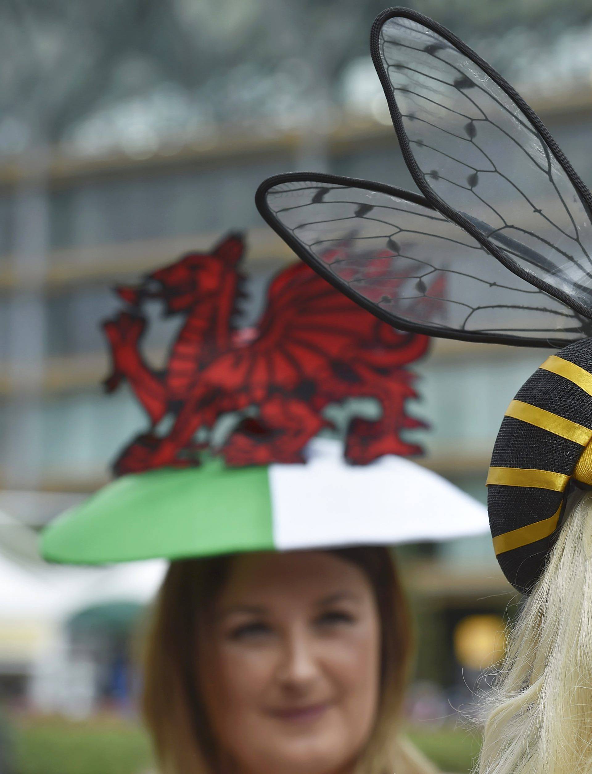 Britain Horse Racing Ladies Day Racegoer wears hat