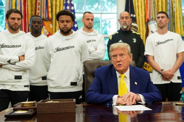 U.S. President Donald Trump meets with players of the Juventus soccer team at the White House in Washington