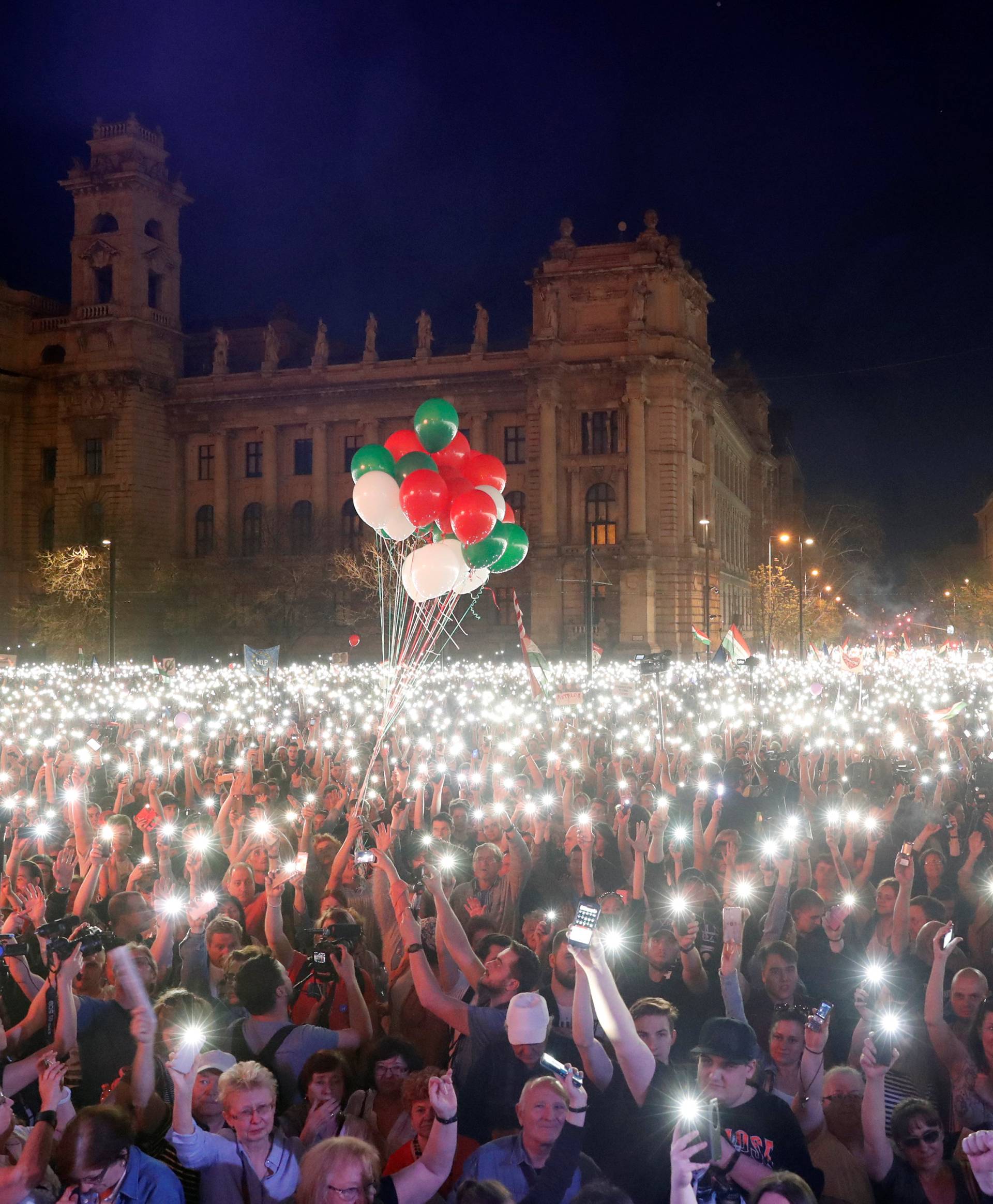 People attend a protest against the government of Prime Minister Viktor Orban in Budapest