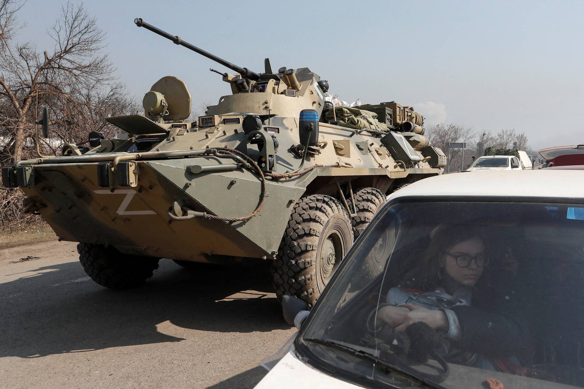 An armoured personnel carrier of pro-Russian troops drives at a checkpoint in the besieged city of Mariupol