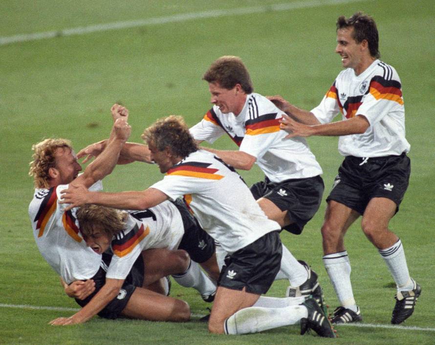 FILE PHOTO: West Germany's Brehme is mobbed by teammates after he scored the only goal of the World Cup final against Argentina on a penalty kick