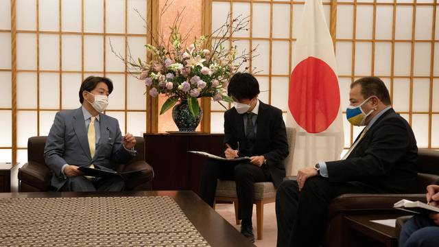 Japan's Foreign Minister greets Yoshimasa Hayashi Ukrainian ambassador Sergiy Korsunsky in Tokyo
