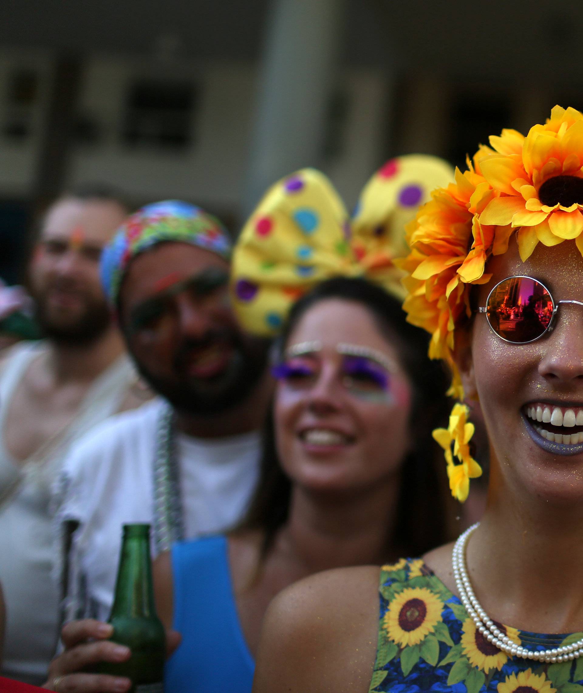 Revellers take part in the annual block party Cordao de Boitata during pre-carnival festivities in Rio Janeiro