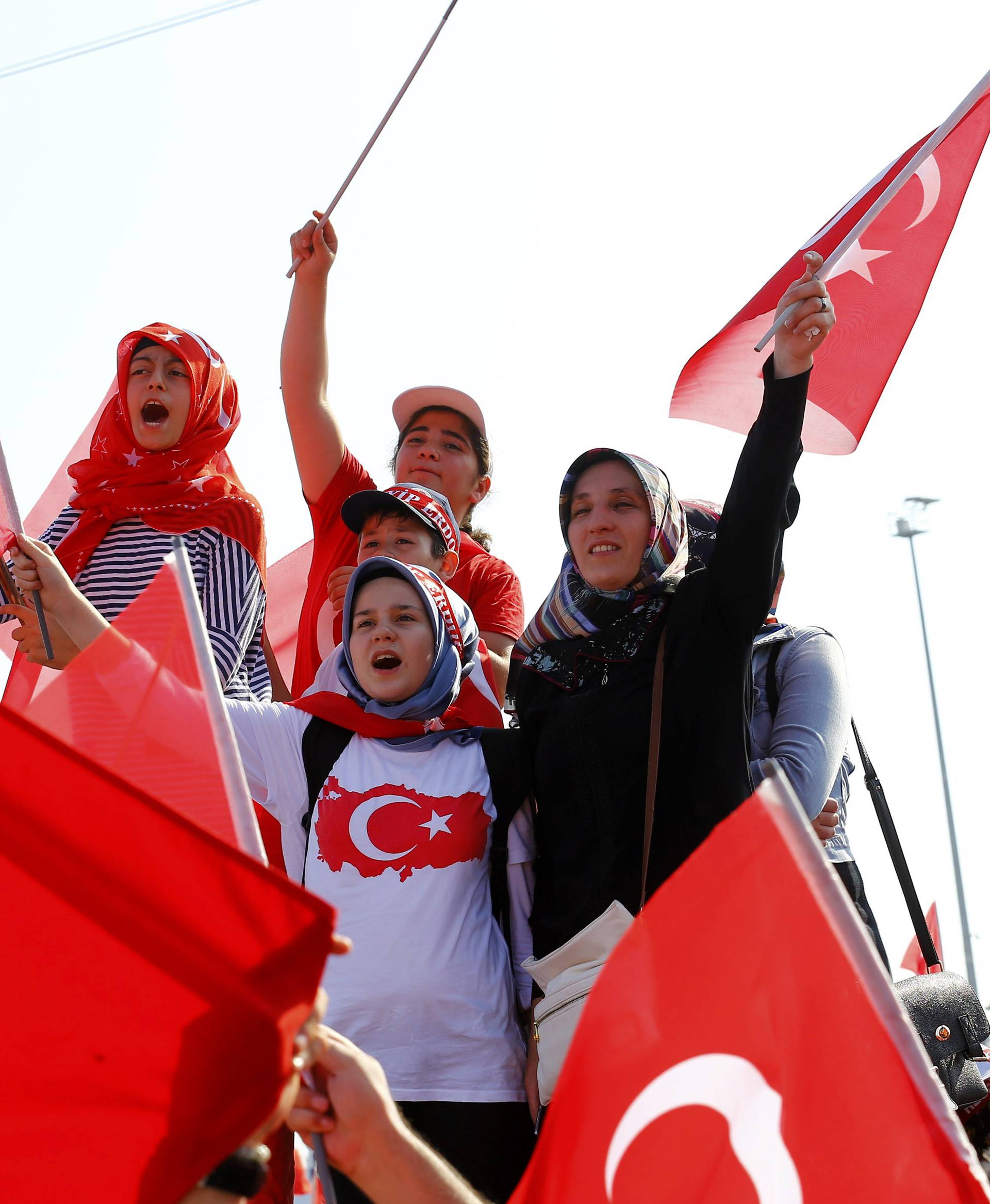 People wave Turkey's national flags during the Democracy and Martyrs Rally in Istanbul