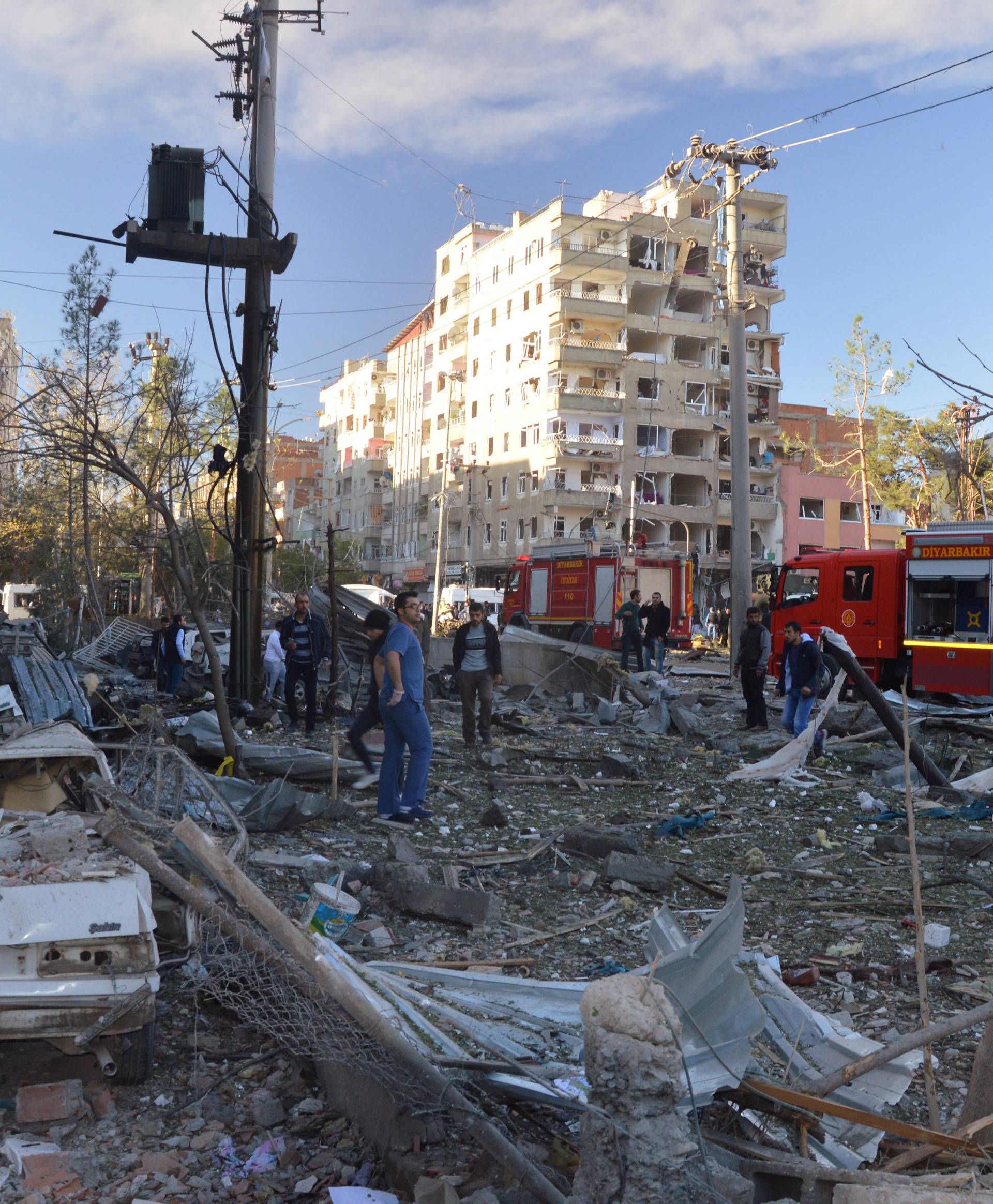 Damaged cars are seen on a street after a blast in Diyarbakir