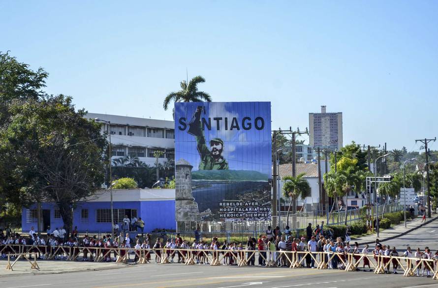 Students file past a tribute to Cuba's late President Fidel Castro in Santiago de Cuba