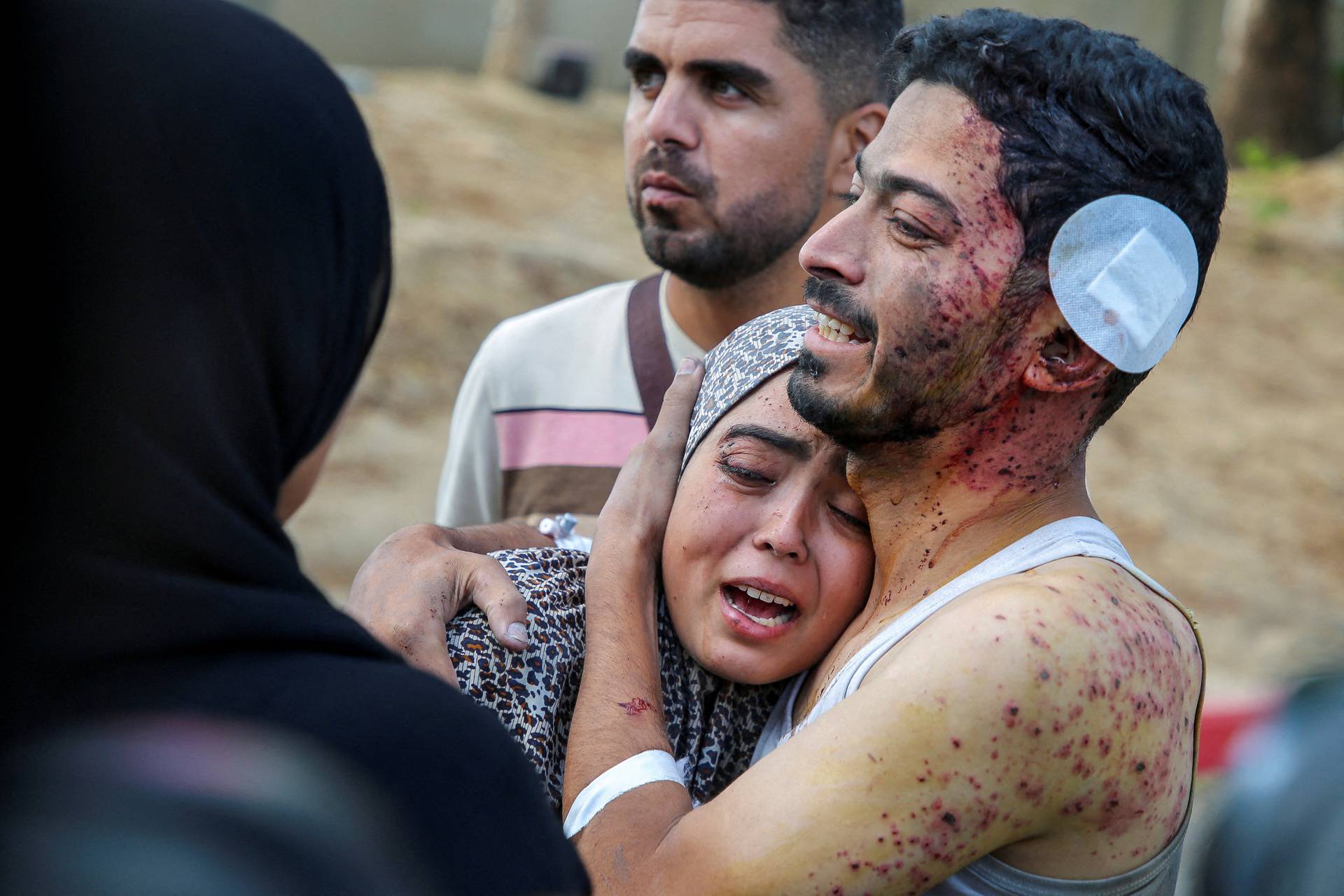 Palestinians mourn loved ones killed in Israeli strikes, in Khan Younis in the southern Gaza Strip