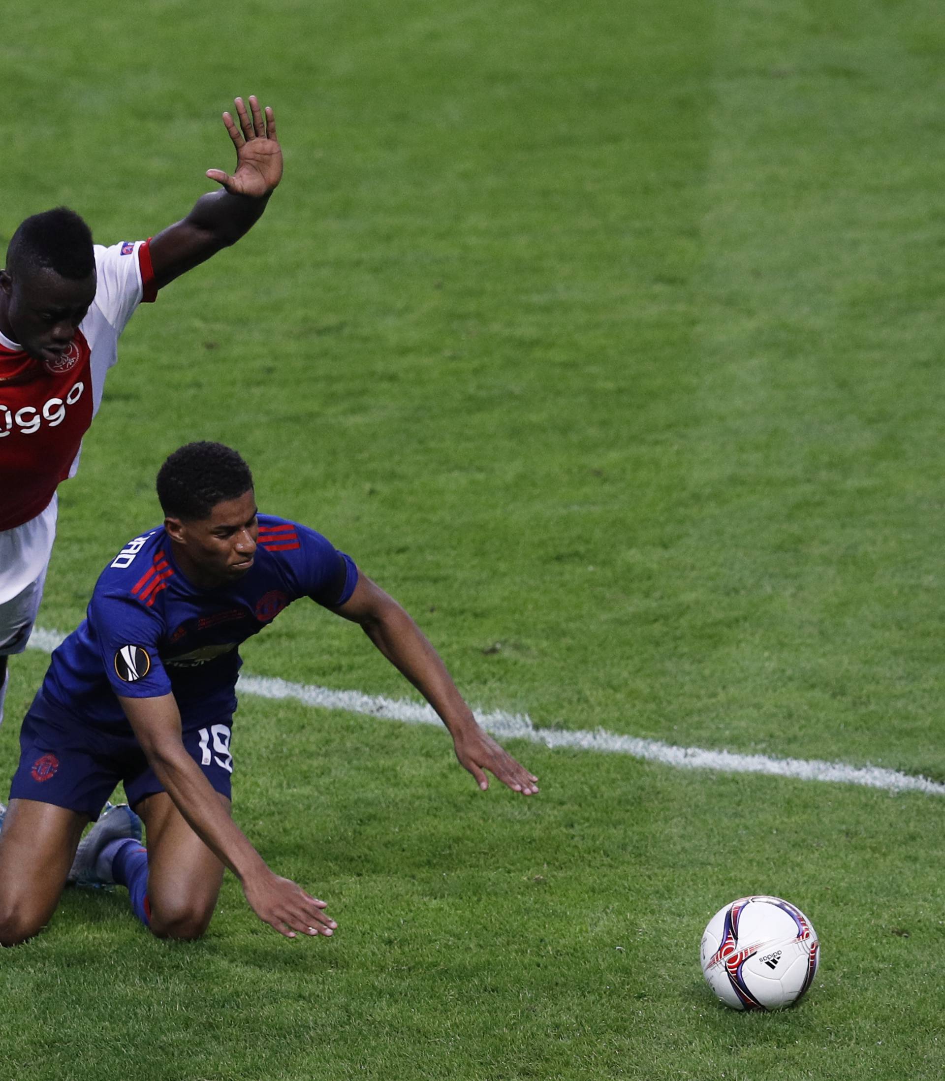 Ajax's Davinson Sanchez in action with Manchester United's Marcus Rashford