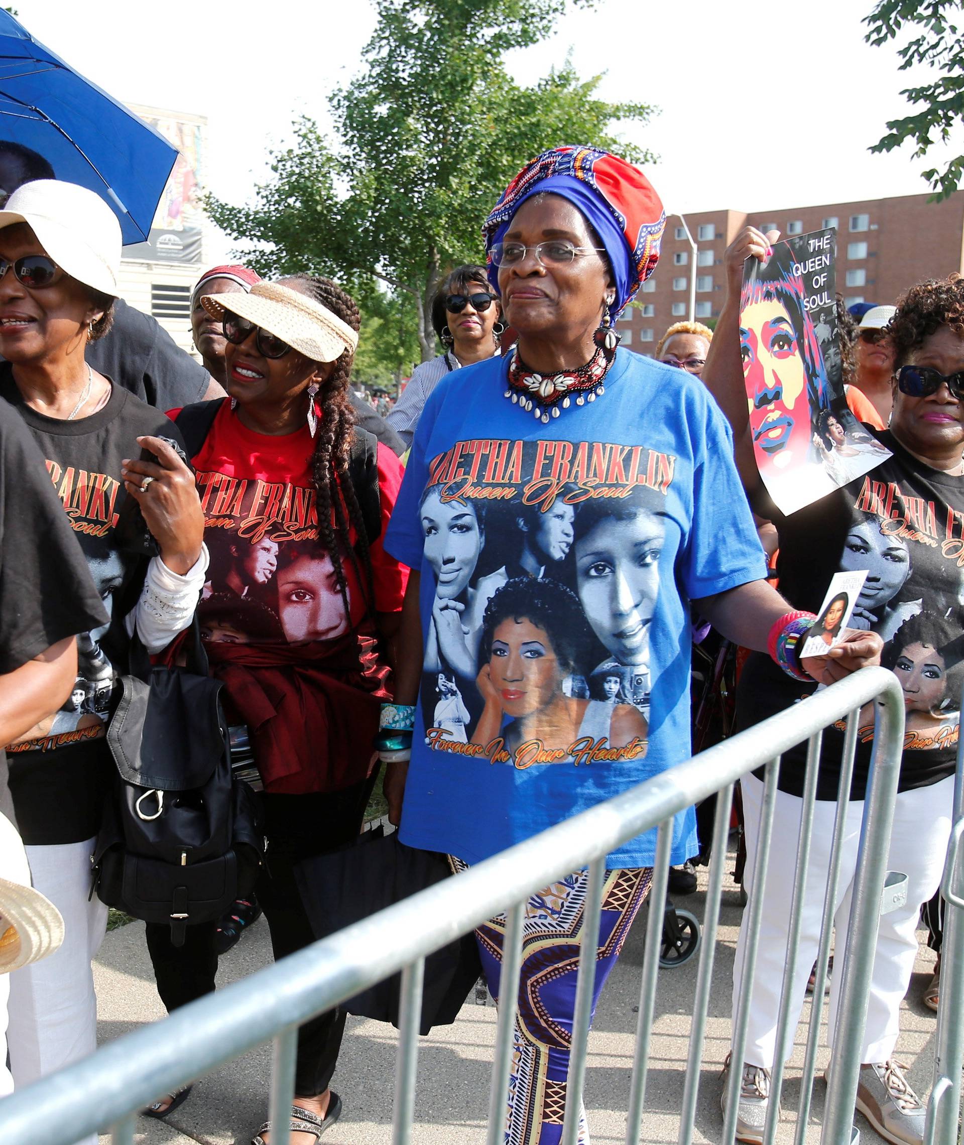 Members of the public wait in line outside the Charles H. Wright African American Museum where the late singer Aretha Franklin will lie in state for two days of public viewing in Detroit,