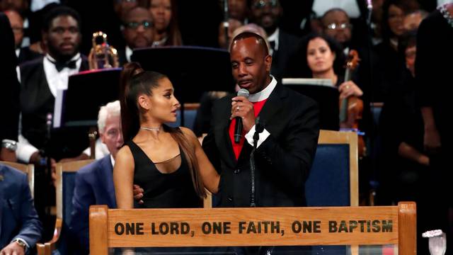 Pastor Charles speaks with singer Ariana Grande after she performed at the funeral service for Aretha Franklin at the Greater Grace Temple in Detroit