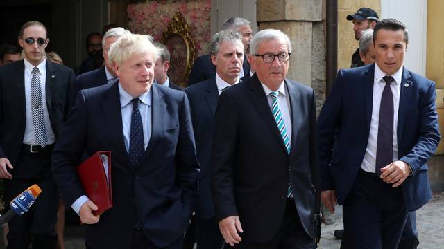 British Prime Minister Boris Johnson and European Commission President Jean-Claude Juncker leave after their meeting in Luxembourg