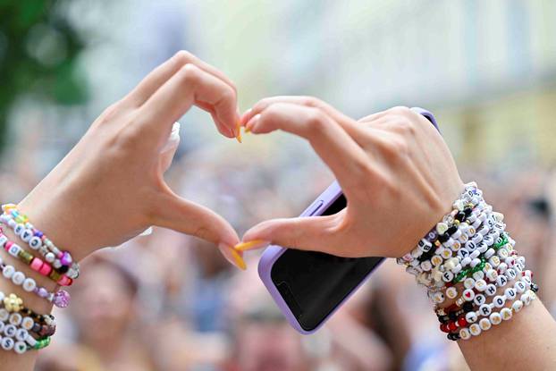 Fans gather after the government confirmed a planned attack at the venue of three Taylor Swift concerts, in Vienna