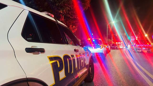 Police vehicles are seen following a shooting incident in Morgan State University, Baltimore