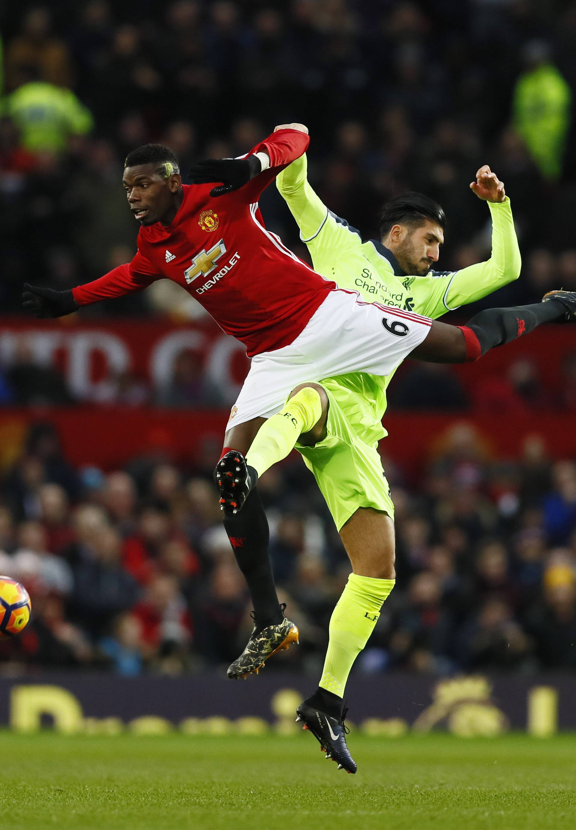 Manchester United's Paul Pogba in action with Liverpool's Emre Can
