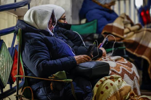 People take shelter inside a metro station during overnight Russian missile and drone attack, in Kyiv