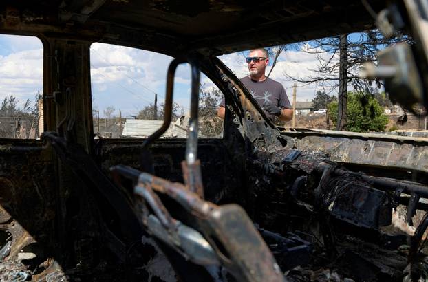 Luke Opperman at his burned home at Hawk Fire in Reno