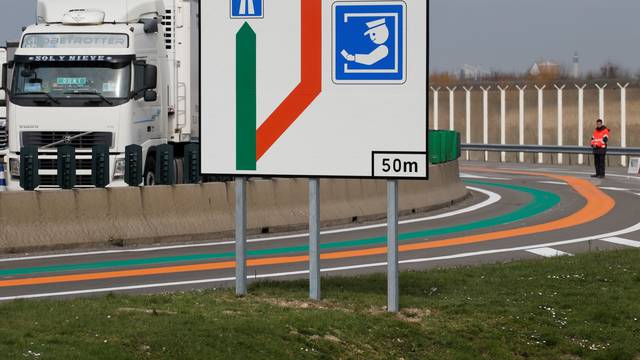 A sign of new orange and green lanes for entry into France and the EU is installed as new customs infrastructure in case of "no deal" Brexit at Eurotunnel terminal in Coquelles