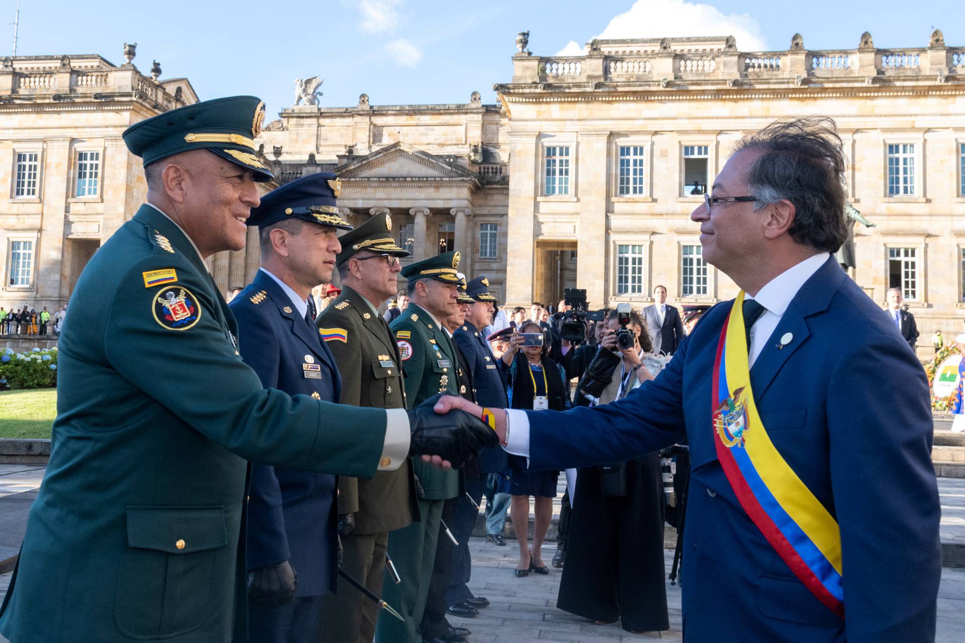 Colombian President Gustavo Petro and Commander of the Colombian Military Forces, General Luis Fernando Navarro shake hands after his swearing-in ceremony at Plaza de Bolivar, in Bogota