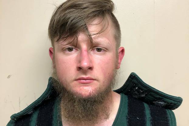 Robert Aaron Long, 21, poses in a jail booking photograph after he was taken into custody by the Crisp County Sheriff