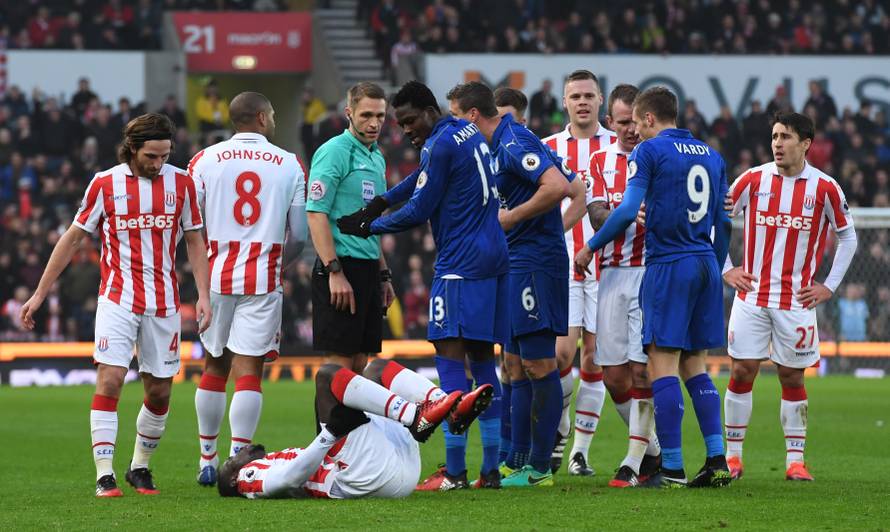 Stoke City's Mame Biram Diouf is down injured after being fouled by Leicester City's Jamie Vardy