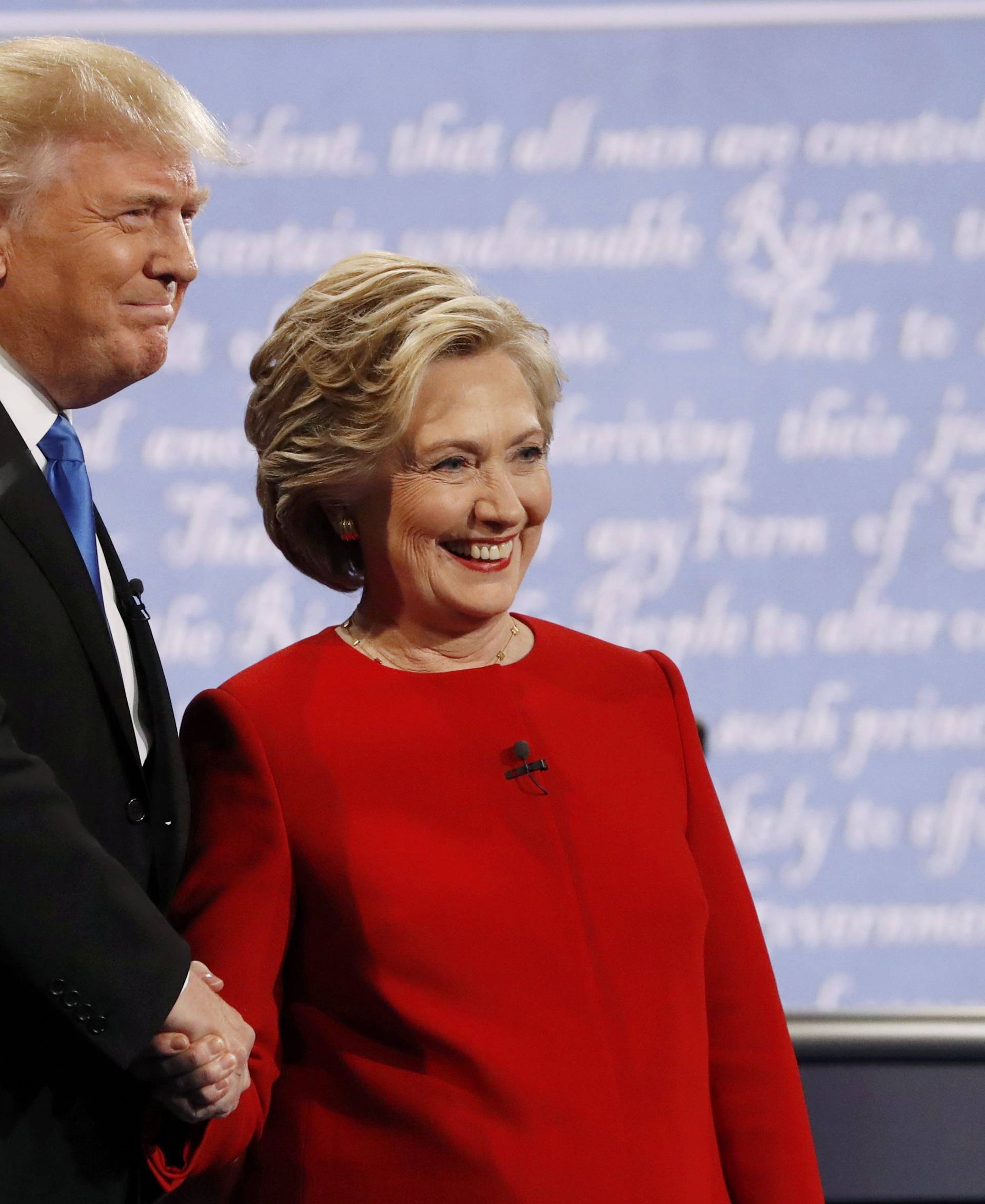 Republican U.S. presidential nominee Donald Trump and Democratic U.S. presidential nominee Hillary Clinton shake hands at the start of their first presidential debate at Hofstra University in Hempstead