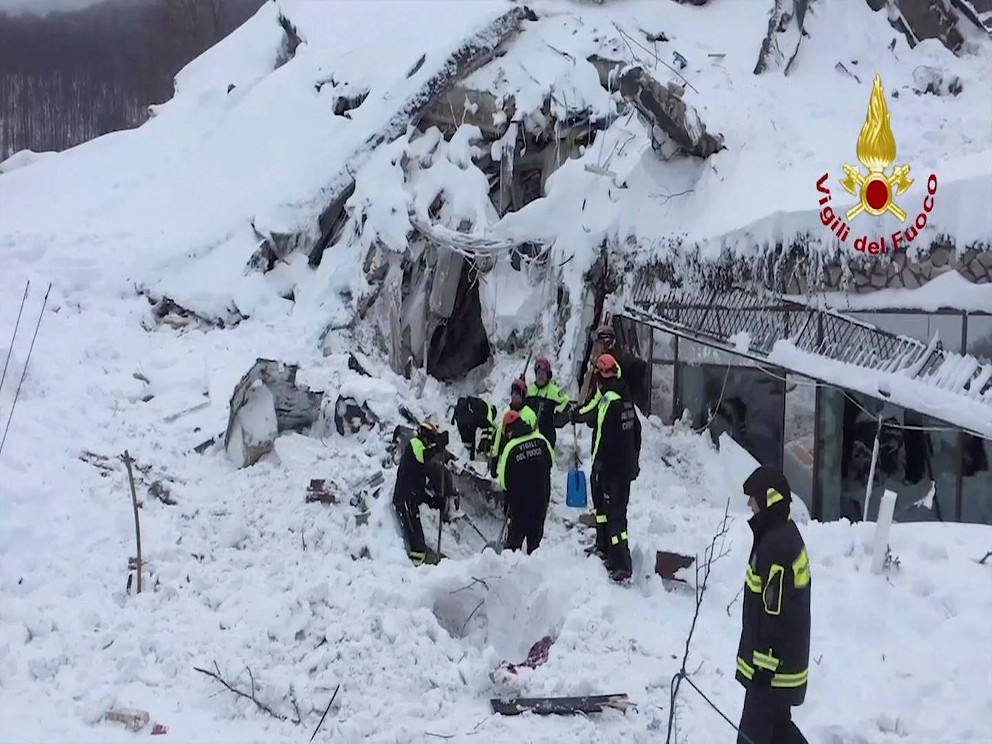 A photo taken from a video shows firefighters work at Hotel Rigopiano in Farindola