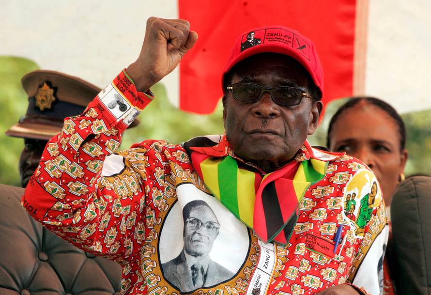 FILE PHOTO -  File photo of Zimbabwe's President Robert Mugabe gesturing at an election rally in the small town of Shamva