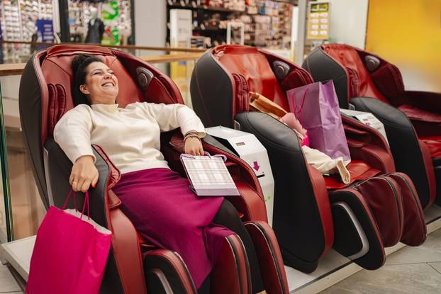 Relaxing,In,A,Massage,Chair,While,Shopping,At,The,Mall