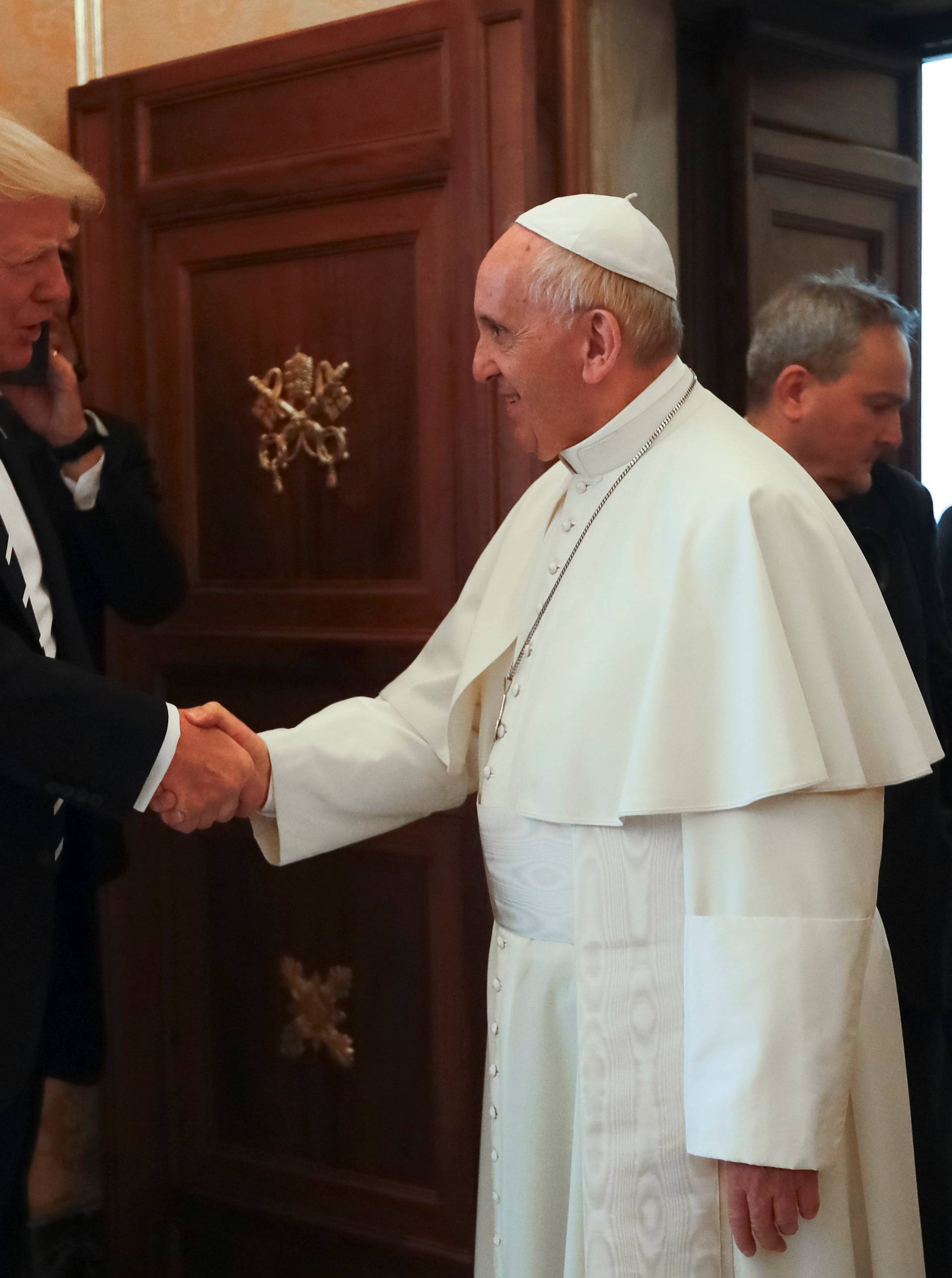Pope Francis meets U.S. President Donald Trump and his wife Melania during a private audience at the Vatican