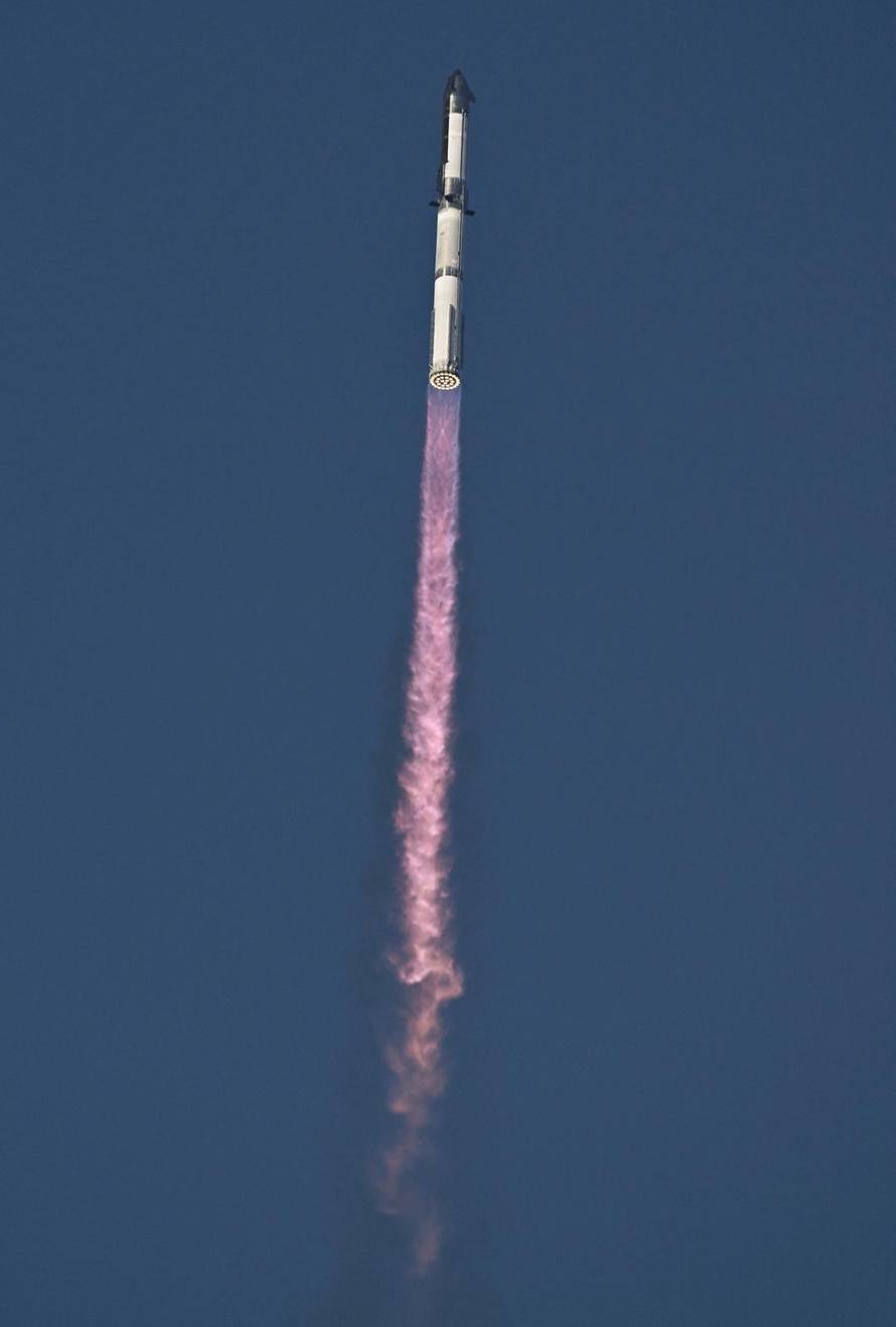 A SpaceX Super Heavy booster carrying the Starship spacecraft lifts off on its 10th test flight