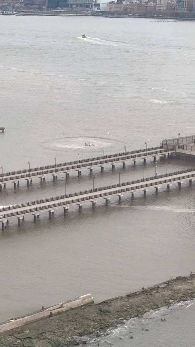 A view shows the site where a helicopter fell into the the Hudson River near lower Manhattan, as seen from Jersey City