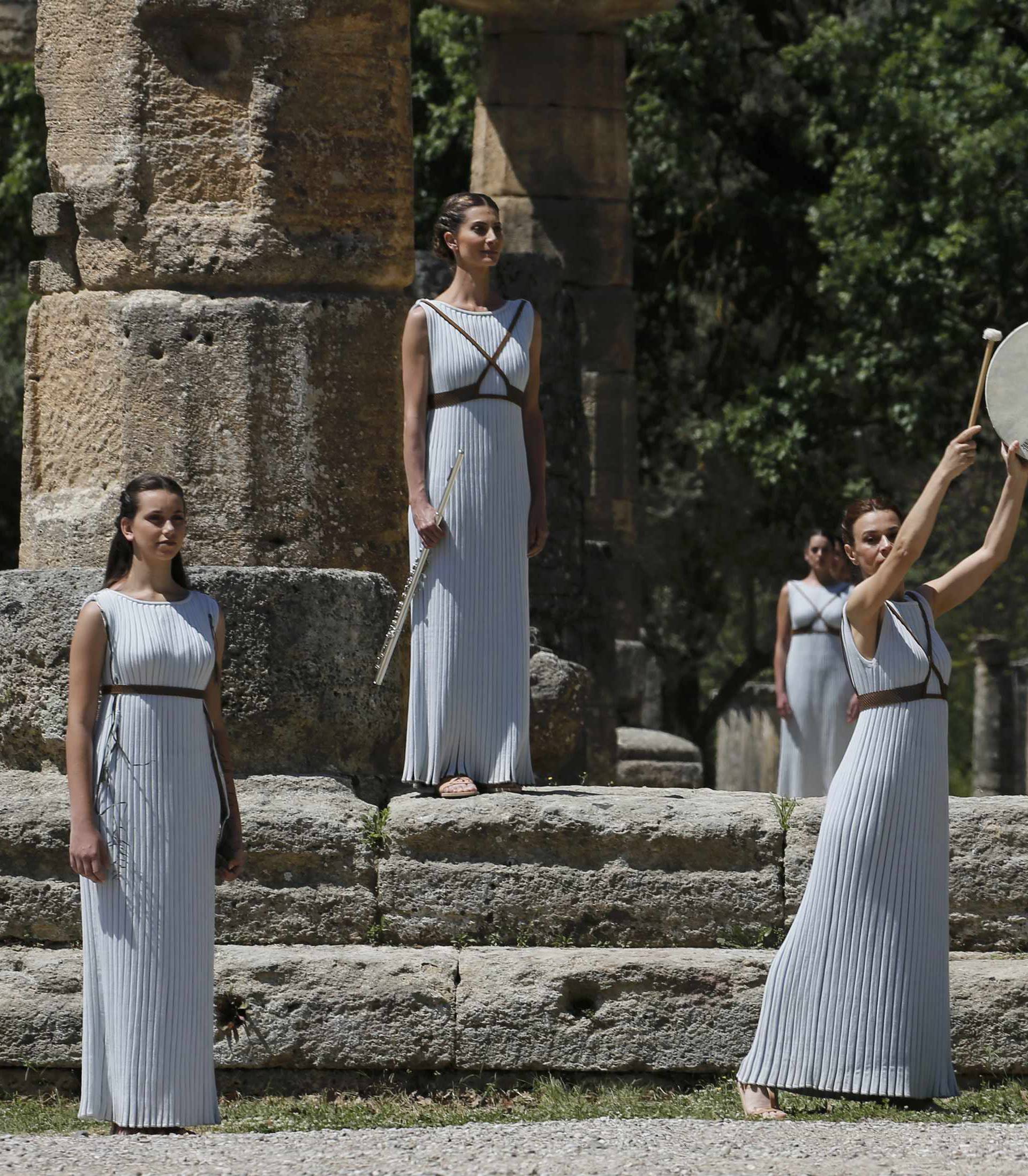 Priestesses attend the Olympic flame lighting ceremony for the Rio 2016 Olympic Games inside the ancient Olympic Stadium on the site of ancient Olympia