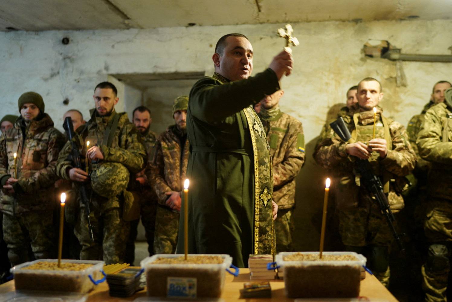 Ukrainian servicemen celebrate Christmas Eve in a front line in Donetsk region