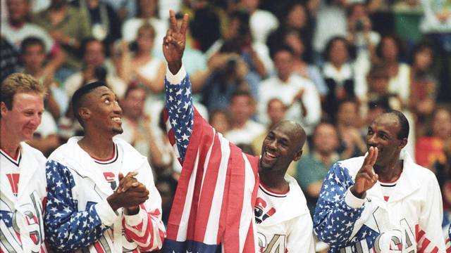 FILE PHOTO: U.S. basketball player Jordan flashes a victory sign as he stands with team mates Larry Bird, Scottie Pippen and Clyde Drexler after winning the Olympic gold in Barcelona