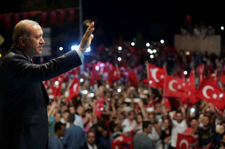 Handout photo of Turkish President Erdogan greeting his supporters outside of his residence in Istanbul