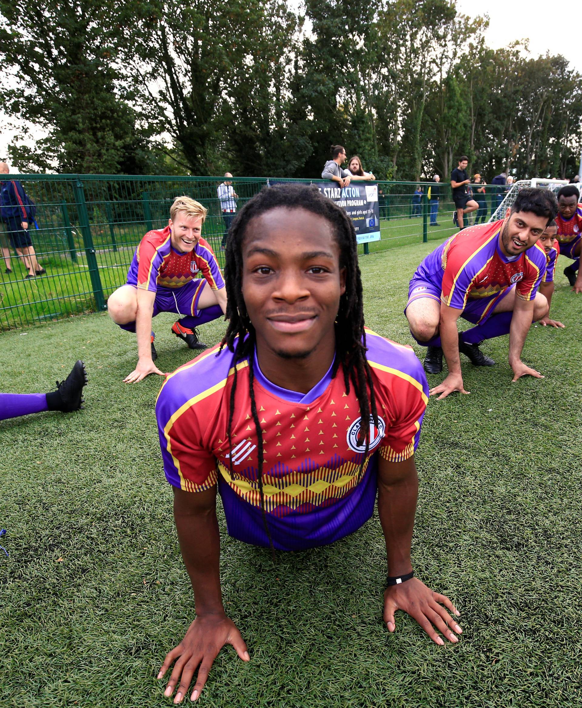 Clapton CFC players prepare for their away game with Healing Town in East Acton, in London