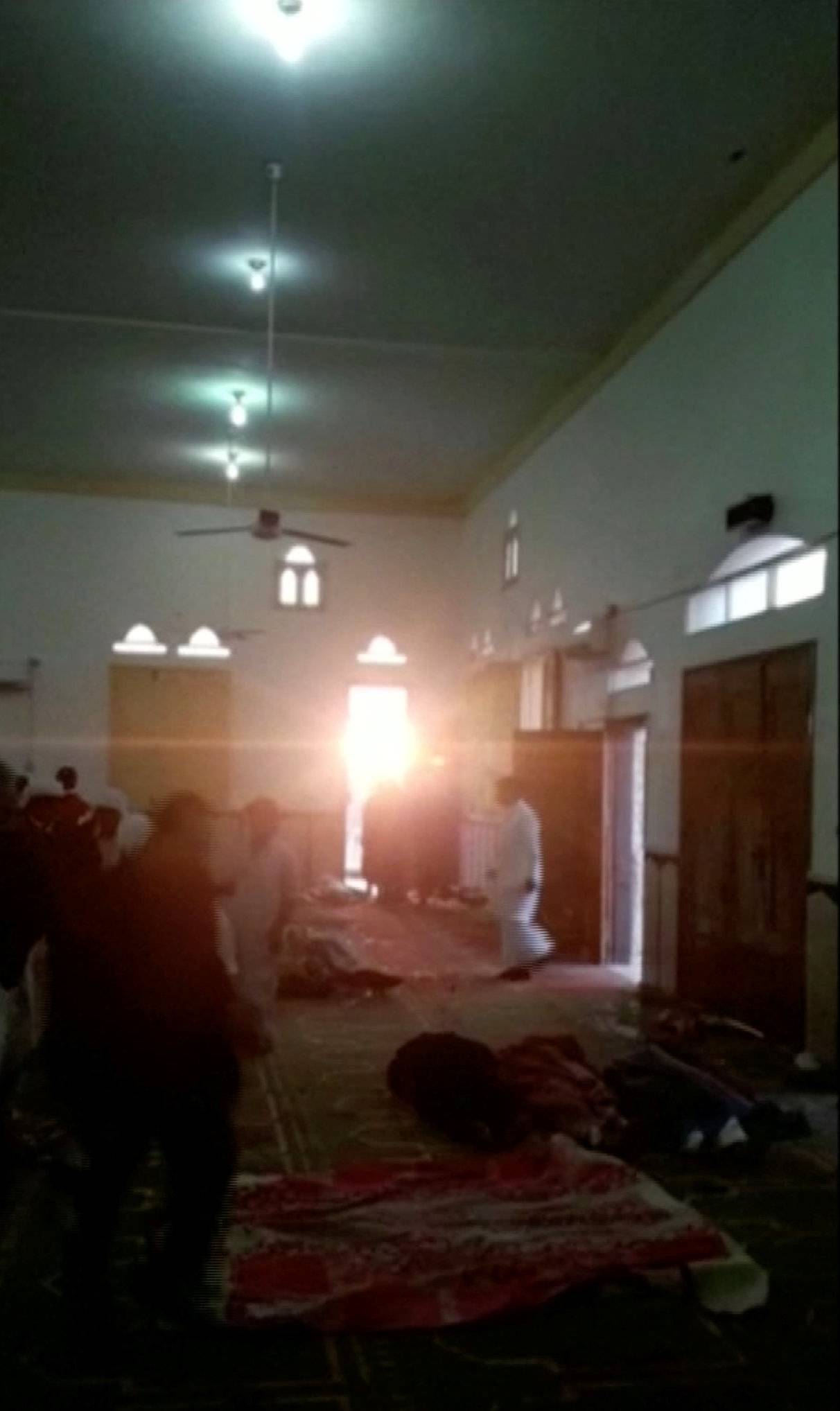Bodies are seen inside Al Rawdah mosque in Bir Al-Abed