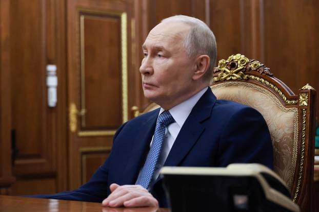 Russian President Vladimir Putin meets with the Head of the Republic of Ingushetia, Makhmud-Ali Kalimatov, in Moscow