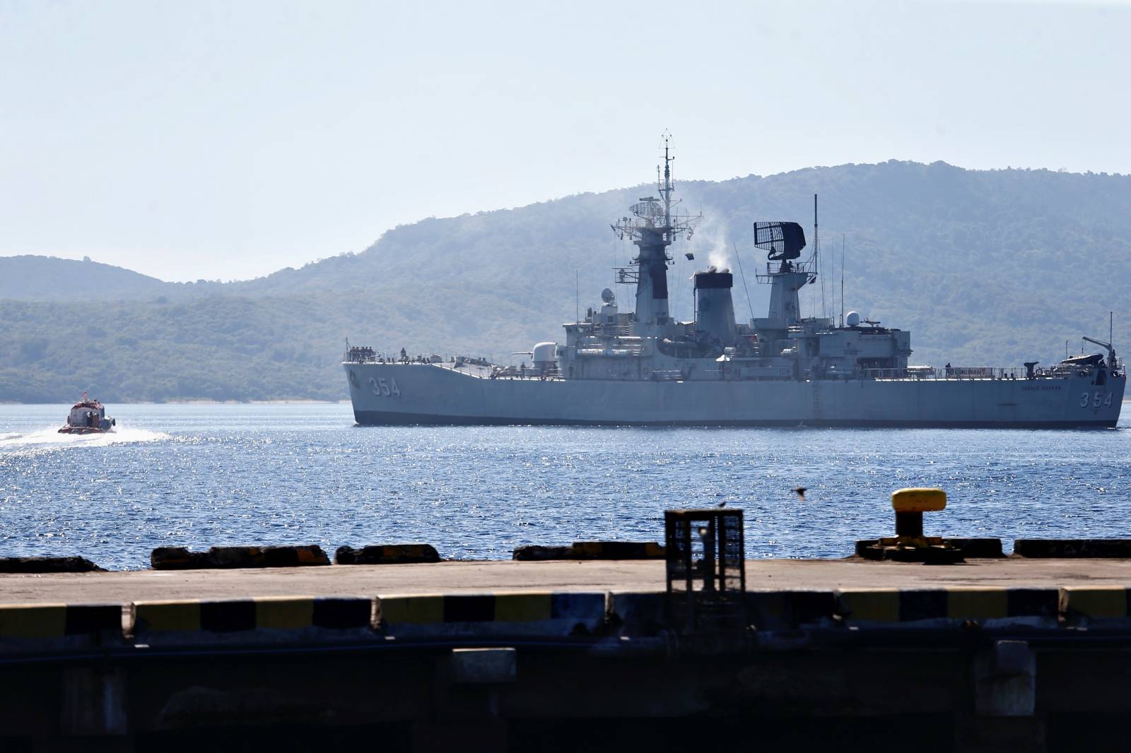 Indonesian Navy's KRI Oswald Siahaan-354 leaves the Tanjung Wangi port as the search continues for the missing KRI Nanggala-402 submarine