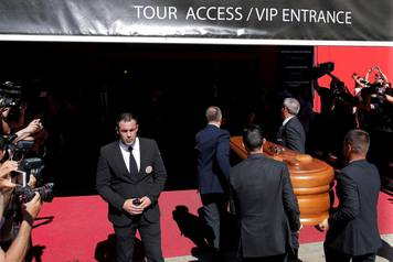 Men carry the coffin containing the body of Spanish footballer Reyes in Seville