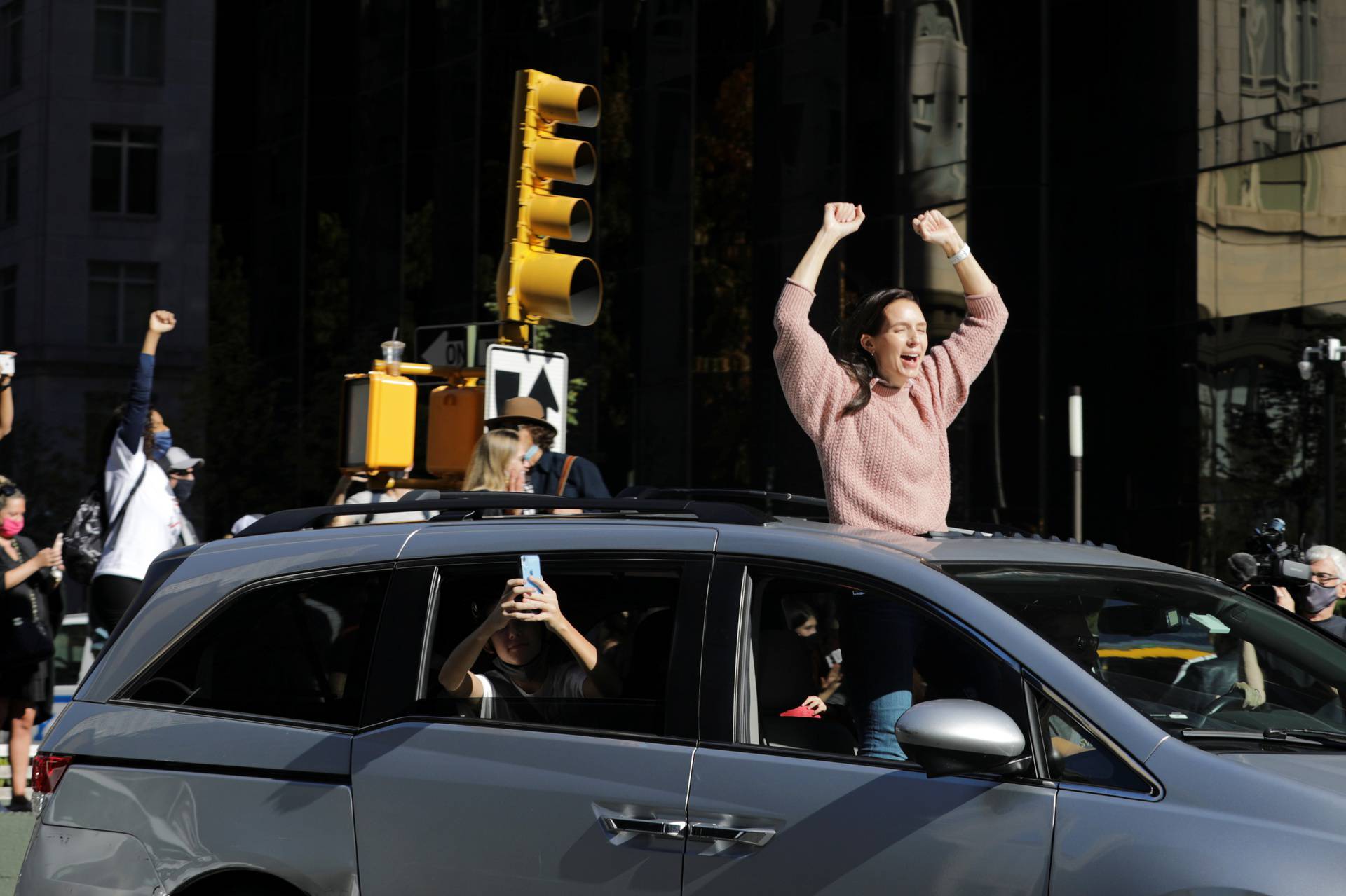 People celebrate media announcing that Democratic U.S. presidential nominee Joe Biden has won the 2020 U.S. presidential election