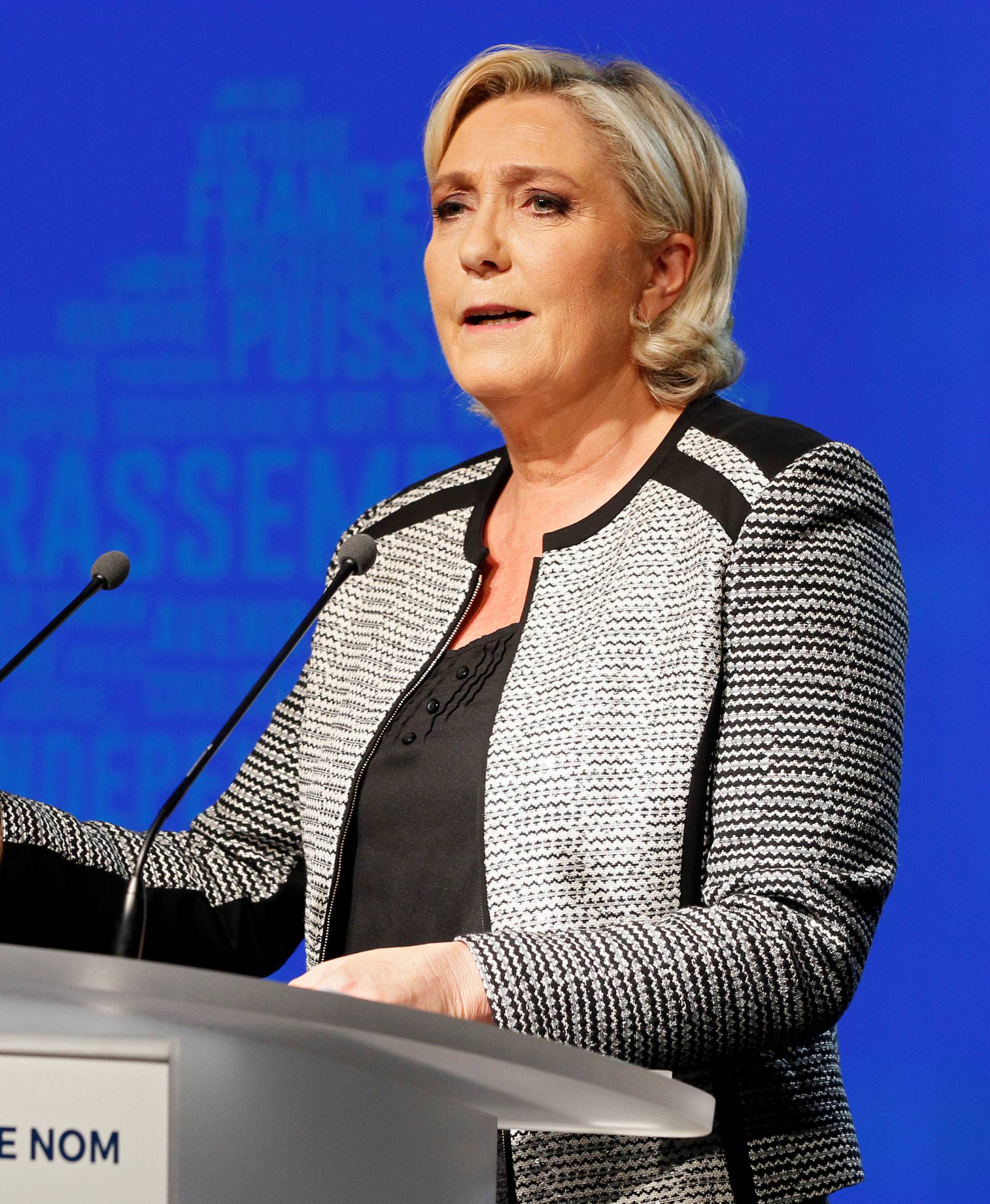 French politician Marine Le Pen delivers a speech to announce the new name of the far-right National Front political party, that becomes the National Rally (Rassemblement National) party, during a national council in Bron