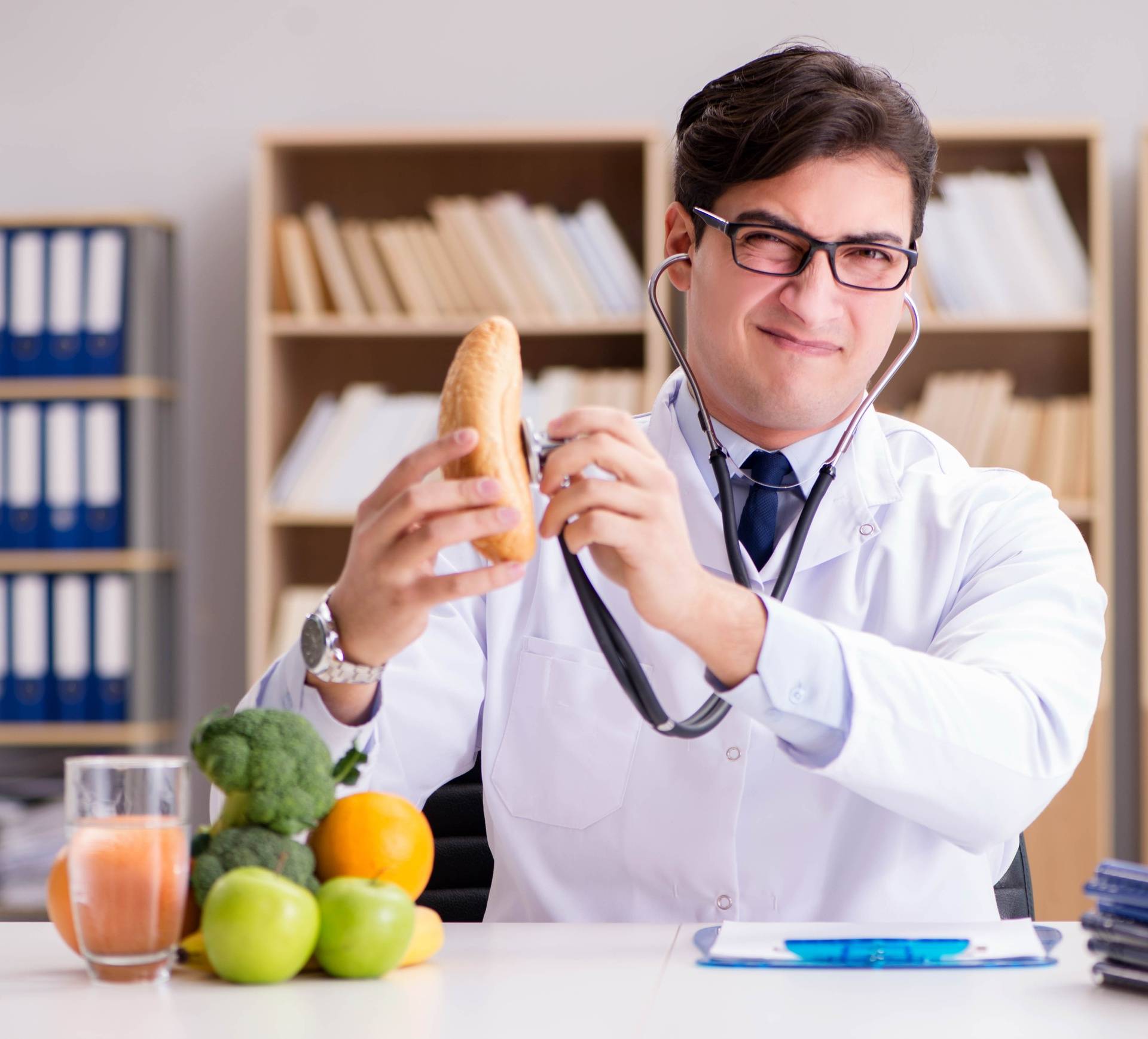 Doctor in dieting concept with fruits and vegetables