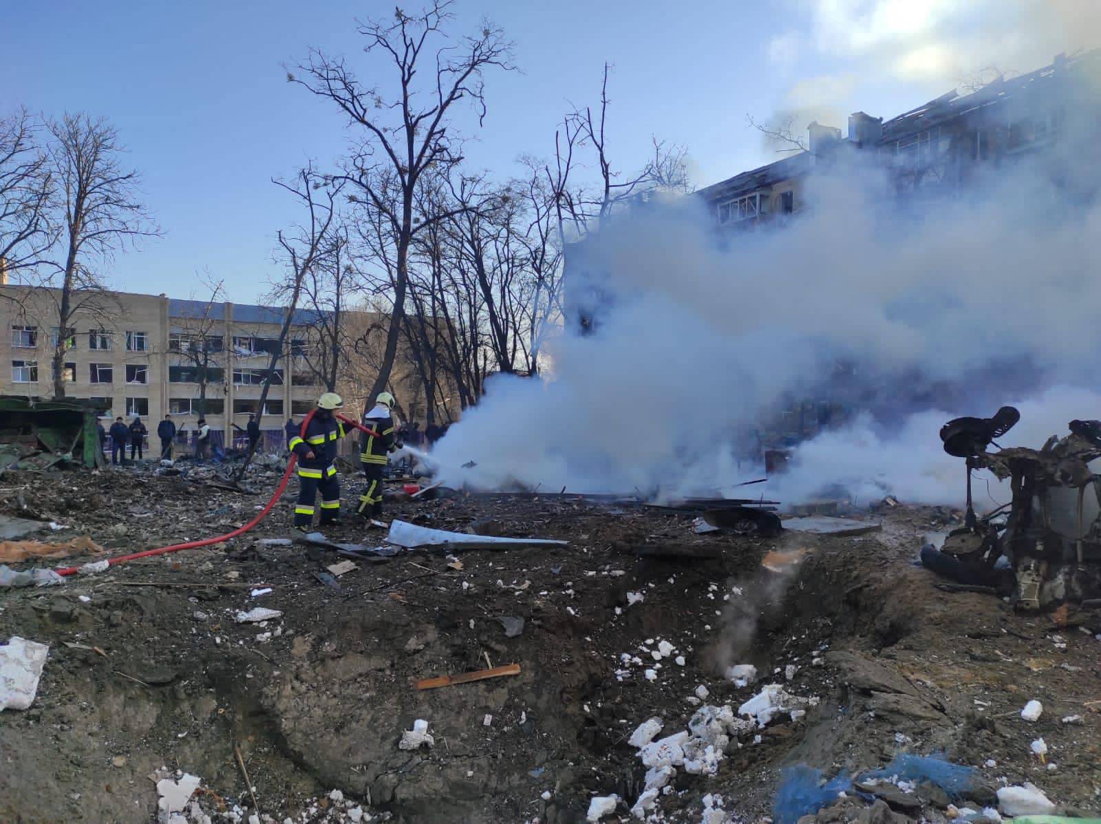 Rescuers work in an area damaged by shelling in Kyiv