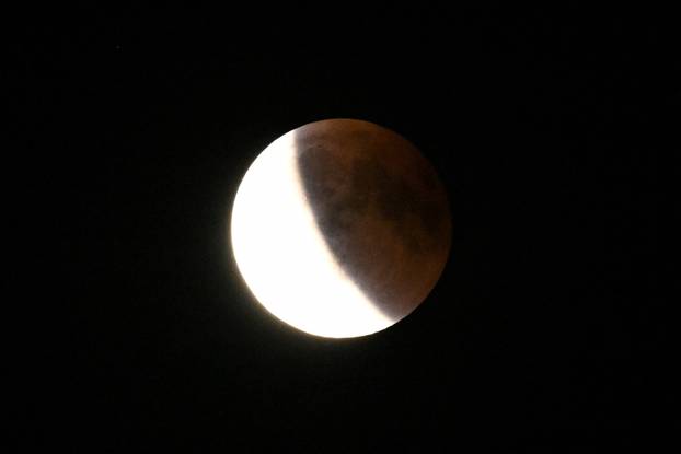 The full moon during a "Blood Moon" total lunar eclipse over Berlin